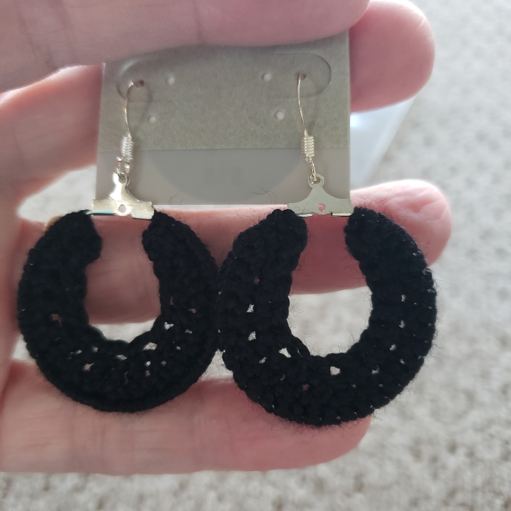 Earrings-Hand crocheted in black thread with silver ear wires.